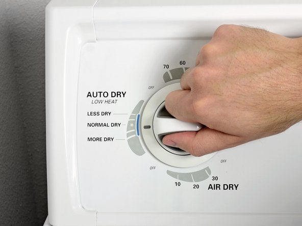 通常の乾燥サイクル時間で、乾燥機を低熱設定に設定します。' alt=