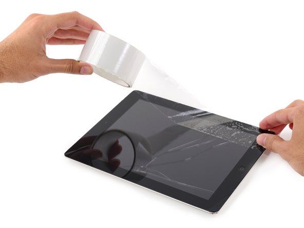 Virs iPad uzlieciet caurspīdīgas caurspīdīgas iepakojuma lentes sloksnes' alt=