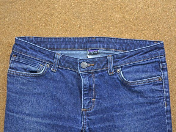 Uji butang baru anda dengan menekan butang jeans untuk memastikan butang baru diatur dan selamat.' alt=