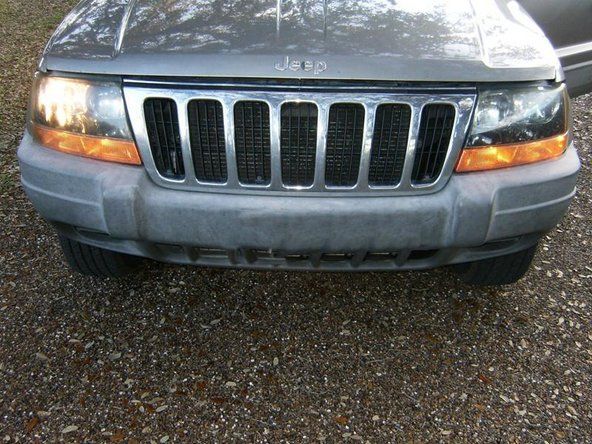 Αντικατάσταση λαμπτήρα προβολέων Jeep Grand Cherokee 1999-2004' alt=