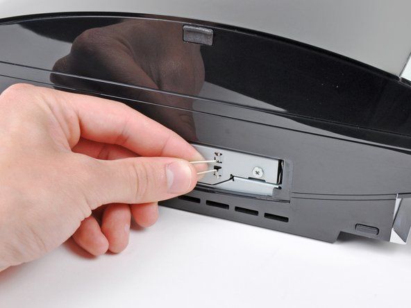 Tarik unit hard drive keluar dari PS3.' alt=